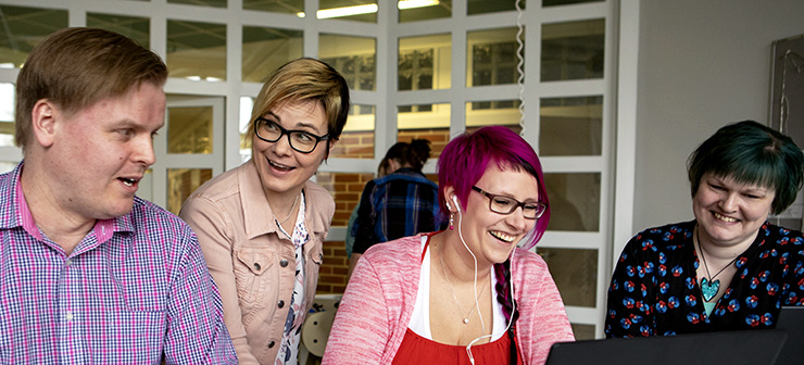 Teacher and students smiling