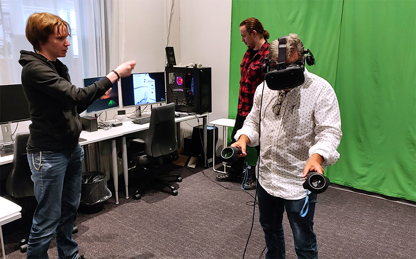 Guiding Mr. Camarda with the controllers. Toni is watching Mr. Camarda’s VR experience from computer’s display.