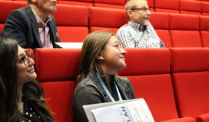 Staff and student listening to the sessions at the auditorium