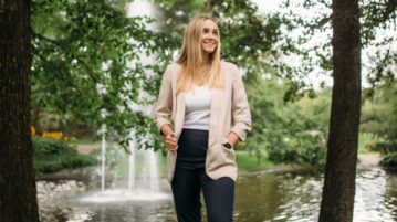 international business alumna ekaterina standing in a park