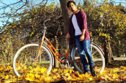 Computer Applications student Siddharth with a bicycle in an autumn surroundings