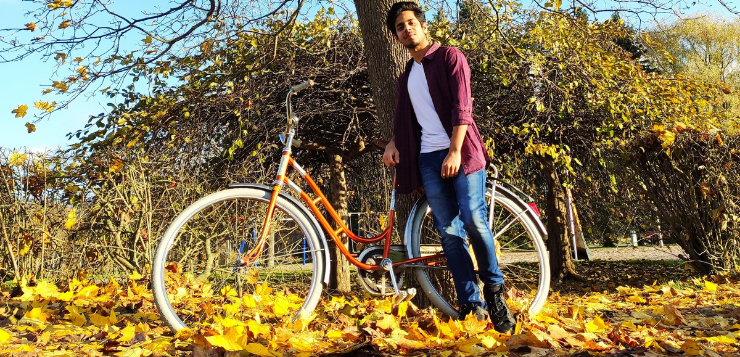 Computer Applications student Siddharth with a bicycle in an autumn surroundings