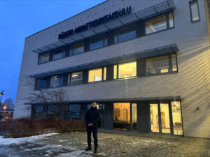 International Business student Marat in front of the HAMK Valkeakoski building